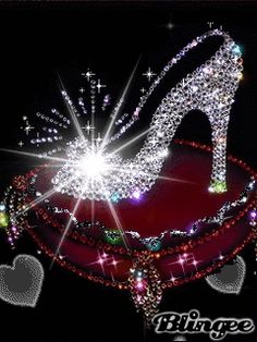 a high heeled shoe with sparkles and hearts on the bottom, in front of a black background