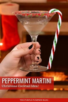 a person holding a martini glass with candy canes in it and the caption peppermin martini christmas cocktail ideas