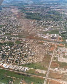 an aerial view of a city with lots of buildings