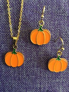 (12,063) Pumpkin Necklace or Earrings  Enamel Gold Tone, 1/2" x 5/8" Earrings on Gold Tone Ear Wires Necklace on 18" Gold Tone Chain Gold Dangle Halloween Jewelry, Halloween Gold Dangle Jewelry, Gold Dangle Jewelry For Halloween, Gold Jewelry For Halloween, Pumpkin Necklace, Wire Necklace, Gold Enamel, Ear Wires, Jewelry Sets