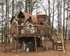 a house made out of wood in the woods