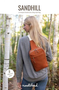 a woman with long blonde hair carrying a brown bag in her back, and the words sandhill on it