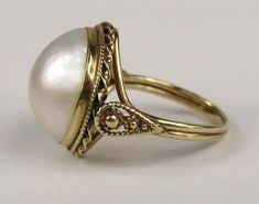 Mabe Pearl Ring, Elegant White Domed Jewelry, Formal 14k Gold Pearl Ring With 17 Jewels, Elegant Yellow Gold Concave Dome Ring, 14k Gold Cabochon Dome Ring For Anniversary, White Domed Rings For Anniversary, White Domed Anniversary Rings, Elegant White Domed Rings, Classic Oval Ring With High Luster