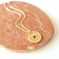 "Beautiful and lovely round medallion charm necklace. Made of navy blue CZ stone gold medallion charm with skinny chain. Simple and warm. Necklace will ship in a gift box. If you have any question, please feel free to contact me. Thanks :) ♥ Necklace length 15\"-20\" ♥ Pendant 3/4\" ♥ Gold plated over brass / Navy Blue Cubic Zirconia ♥ Delivery Time Fast shipping within 1 - 3 days ♥ See more Rudiana Accessories Rudiana.etsy.com" Blue Coin Pendant Jewelry As Gift, Round Pendant Medallion Necklace With Compass Design For Gift, Medallion Necklace With Compass Design For Gift, Blue Coin Pendant Jewelry For Gifts, Blue Medallion Necklace For Spiritual Style, Gift Medallion Necklace With Compass Design, Gold Medallion Necklace With Compass Design For Gifts, Gold-tone Medallion Necklace Gift, Gift Compass Design Round Pendant Medallion Necklace