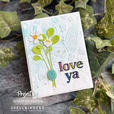 a card with flowers and leaves on it