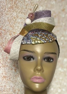 This Small Yellow, bronze, peach, and purple pastel multicolor disc Sinamay fascinator cocktail hat is trimmed with sinamay bows, and rhinestones. The hat pin may vary and is for decorative purposes only. Make a statement with this gorgeous piece! The hat measures approximately 5.3 inches in diameter. The hat affixes to the head by a hat elastic/string. Handmade Gifts for mom, sister, wife, bridesmaids, mother of the bride or yourself. SHIPPING All items for free shipping will be shipped via USP Luxury Multicolor Mini Hats For Wedding, Luxury Purple Mini Hats For Wedding, Handmade Gifts For Mom, Fascinator Hats Diy, Sinamay Fascinator, Multicolor Sequins, Purple Pastel, Tea Party Wedding, Fascinator Hat