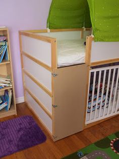 a child's bedroom with bunk beds and bookshelves