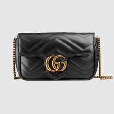 Shop the GG Marmont matelassé leather super mini bag in black at GUCCI.COM. Enjoy Free Shipping and Complimentary Gift Wrapping. Gg Marmont Super Mini Bag, Gg Marmont Mini Bag, Gucci Gg Marmont Matelasse, Gucci Mini, Gucci Gifts, Gg Marmont, Mini Purse, Gucci Handbags