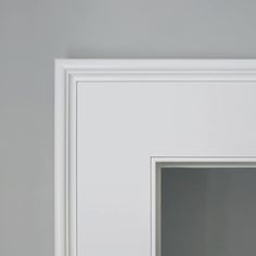 an open white door in a gray room