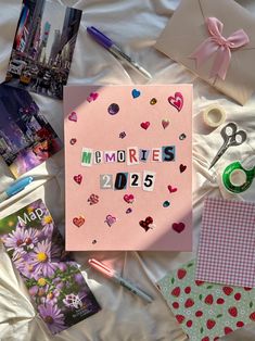 a pink card with the word memories written on it surrounded by other cards and craft supplies