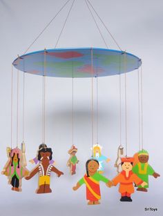 a group of toy figures hanging from strings