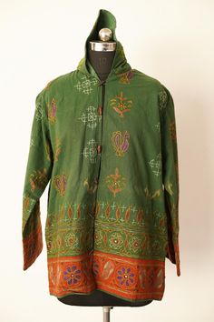 Welcome To Our Shop Product: One-Of-A-kind Handmade 100% Cotton Vintage Kantha Jacket. Color: Multi-color as Shown in Image. Fabric: 100% cotton ( Handmade In India ) The design of the jacket is very unique and very rare. Indian culture and associated with grace and beauty. Old hand made raali more then 1970s old pieces collected From villages Of Thar Desert converted into the vintage jacket and backside beautiful embroidery elephant work, This Raali belongs to higher caste people they give this Traditional Long Sleeve Outerwear For Fall, Fall Bohemian Outerwear With Stand Collar, Folk Style Cotton Outerwear For Fall, Embroidered Green Outerwear For Winter, Embroidered Green Winter Outerwear, Traditional Green Outerwear With Stand Collar, Traditional Hooded Outerwear For Festival, Vintage Multicolor Outerwear For Festival, Hippie Winter Outerwear With Pockets