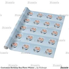 a baby boy photo wrapping paper with the name and image of his head on it