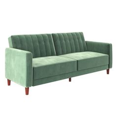 a green couch sitting on top of a white floor