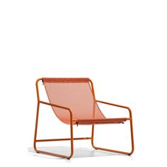 an orange chair sitting on top of a white floor