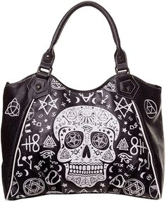 This spacious bag has plenty of room to carry all of your things and keep you organized. The inside of the bag is separated into two compartments by a large zippered pouch. There is another smaller zippered pouch and two pockets inside and one zippered pouch on the back of the bag. The handbag has a zipper closure and Skull Ideas, Satanic Clothing, Skull Handbags, Skull Accessories, Gothic Bag, Metal Skull, Retro Bags, Black Skull, Black Skulls