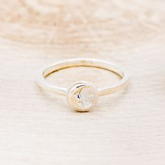 Product Details Ring Style: A celestial-style ring featuring a crescent moon and a star. This ring is pictured in silver. Width: The width of the ring pictured is approximately 2mm wide. Top Dimension: 7.34 mmx7.34 mm Available In: Silver, 14K White Gold, 14K Yellow Gold, 14K Rose Gold Each of our rings is a one-of-a-kind piece and is made to order for you and your significant other by a passionate and skilled artisan. | Celestial Ring Featuring A Crescent Moon & A Star - by Staghead Designs - S Celestial Crescent Moonstone Ring, Celestial Style White Gold Rings, White Gold Moon Phase Ring For Promise, White Gold Moon Phase Promise Ring, Sterling Silver Crescent Moonstone Promise Ring, Silver Crescent Moonstone Ring In Celestial Style, Silver Moonstone Ring With Sun And Moon Design, Celestial Silver Moonstone Ring With Sun And Moon Design, Celestial Rings With Moon Phase