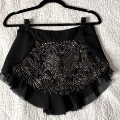 Free People Black Beaded Tap Shorts. Satin Lined With Flutter Layer At Edges. Hidden Side Zip And Snap. Flawless Beading, Extra Beads Still Attached. Nwot. Never Worn. 1920s Vibe. Elegant Ruffled Skort For Party, Black Embellished Mini Skirt For Cocktail, Glamorous Mini Skirt For Festival, Embellished Fitted Bottoms For Cocktail, Embellished Mini Skirt For Cocktail, Elegant Mini Skirt For Festival, Elegant Black Bottoms For Festival, Party Season Embellished Skirt Bottoms, Elegant Black Festival Bottoms