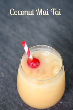 there is a drink with a straw in it on the table and text that reads coconut mai tai