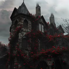 an old gothic building with red flowers growing on it's side and dark clouds in the background