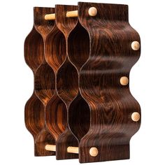 a wooden wall shelf with several holes in it