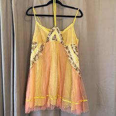 This Paneled Dress (Or Top) Is Something Out Of A Fairytale. It Has A Yellow Slip Underneath With A Pink Lemonade Mesh On Top. Patterned Details (See Photo) With Beading And Floral Fabric On Front. Ties Around The Neck. Very Short! Could Be Worn As Nightgown, Or Even A Top. Bohemian Yellow Mini Dress For Party, Spring Party Lace Nightgown, Yellow Summer Nightgown, Yellow Summer Nightgown For Sleep, Yellow Lace Mini Dress For Summer, Fitted Nightgown For Summer Parties, Fitted Summer Nightgown For Party, Yellow Sleeveless Summer Sleepwear, Yellow Summer Sleep Dress