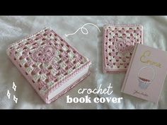 the crochet book cover is pink and white