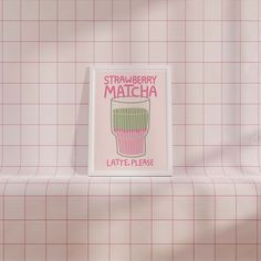 a pink and white tiled wall with a sign that reads strawberry matcha latte please