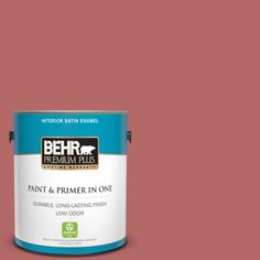 a can of behr premium plus paint and primer in one on a blue background