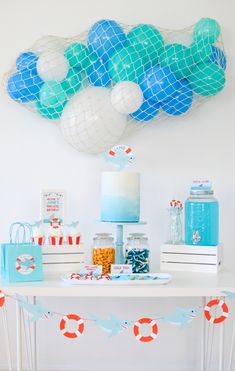 an ocean themed birthday party with balloons and decorations