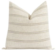 a beige and brown striped pillow on a white background with a tan stripe down the middle