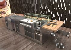 an outdoor kitchen with stainless steel appliances and wood flooring is featured in this image