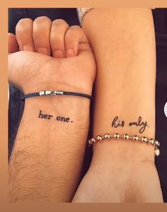 two people with matching tattoos on their arms and one has the words her one, his only