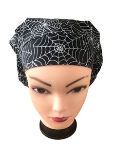 2 styles of caps are available in this black & white spider web cotton fabric.  Regular is the classic Bouffant style for long or thick hair. Ample elastic ensures a perfect, comfortable fit no matter how much hair is under the cap.  Modified has Approx 35% less volume and a front panel with slightly less height.  Perfect for short to medium hair.  Color coordinating toggle for a perfect fit, serged seams for durability and double stitched coordinating  elastic.  Pattern is carefully placed to optimize the best look for your cap and care goes into every stitch.  Looking for a specific theme or a sold out item?  just drop me a message.      * PLEASE NOTE:  the last photo shows the difference in styles from a different cap.  Modified caps are made on demand from the pictured Spider web fabri Short To Medium Hair, Black And White Spider, Medium Hair Color, White Spider, Bouffant Scrub Caps, Spooky Spiders, Medium Short Hair, Spider Webs, Scrub Caps