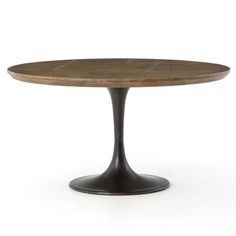 an oval wooden table with black metal base