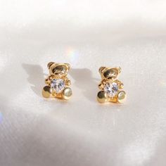 Teddy Bear Stud Earrings - cuddle up with our super cute teddy bear stud earrings! Teddy bears are holding sparkling heart cut crystals - so dreamy & nostalgic! Dainty gold stud earrings. Wildflower + Co. ♥ Measurements: dainty! ♥ Materials: gold dipped metal & glass crystal. Posts are titanium - good for sensitive ears! ♥ Packaged in our cute gift box ♥ Designed by & exclusive to Wildflower + Co. ♥ Imported ♥ Product safety - intended for use by adults only; CA residents - see shop Teddy Bear Earrings, Bear Earrings, Cute Teddy Bear, Gift Box Design, Cute Teddy, Cute Gift Boxes, Shine Bright Like A Diamond, Cute Teddy Bears, Earrings Cute