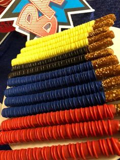 corn on the cob sticks are arranged in different colors