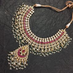 Beautiful Kundan Choker with White and Pink Kundan Stone combination like shown in picture with pearls stringing and Matching Stylist Earrings.Its earrings is about 2.5 Inch long with pearls hangings and Matching Mangtikka. *It's beautiful Ethnic Indian Wedding Necklace with Earrings. *Necklace and Earrings are same like shown in picture. *It will come with adjustable string which fits all Neck size. *Our all jewelry is made from semiprecious stones and beads. *WARRANTY: ITS GENUINE HANDMADE JEW Heavy Chandbali Bridal Necklace For Festivals, Festive Traditional Kundan Necklace With Latkans, Bollywood Style Temple Necklace With Chandbali Stone Work, Traditional Kundan Necklace For Wedding And Navratri, Traditional Kundan Necklace With Pallu For Wedding, Bollywood Chandbali Temple Necklace With Stone Work, Kundan Chandbali Necklace For Wedding, Kundan Necklace With Traditional Drape For Festivals, Chandbali Kundan Necklace With Zari Work For Puja