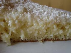 a close up of a piece of cake on a plate with sugar sprinkled on top