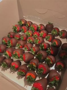 a box filled with chocolate covered strawberries