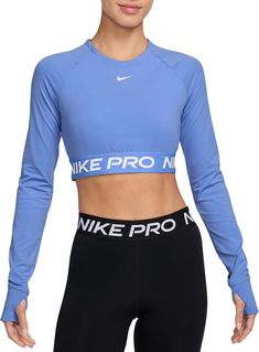 Get your sweat on in this cropped Nike Pro top. Lightweight and stretchy, the smooth fabric dries quickly to help you stay ready when your workout heats up. With a body-hugging fit and soft jacquard elastic band at the hem, you can feel secure as you crush your goals. Fit & Design: Tight fit: snug and form-fitting Nike Dri-FIT technology moves sweat away from your skin for quicker evaporation, helping you stay dry and comfortable Thumbholes let you extend your coverage and help hold the sleeves in place while you move Cropped Nike, Compression Top, Womens Athletic Outfits, Cropped Long Sleeve Top, Athletic Apparel, Athletic Outfits, Nike Pros, Nike Dri Fit, Elastic Band