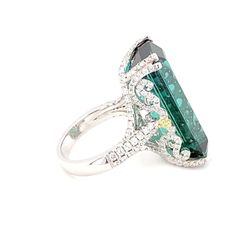 For Sale on 1stDibs - This magnificent 21.86 carat baguette cut Indicolite Tourmaline Diamond ring is mounted in white gold. This exceedingly feminine ring dazzles with the Luxury Emerald Ring With Baguette Cut And Accent Stones, Luxury Tourmaline Rings, Luxury Tourmaline Emerald Ring, Formal Tourmaline Ring With Baguette Cut, Formal Tourmaline Baguette Cut Rings, Indicolite Tourmaline, Gold Cocktail Ring, Gold Cocktail, Baguette Cut