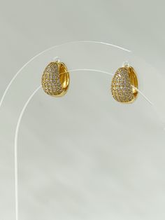 The Radiant Stone Huggies are an update to our classic style, with a teardrop design adding a few extra rows of shine. Paired with the Classic Stone Huggies, this is our favorite earring stack. 18K gold plating on 925 sterling silver Cubic zirconia Water resistant, hypoallergenic Earring Stack, Gold Plating, Cubic Zirconia, Classic Style, 18k Gold, Gold Plate, Water Resistant, 925 Sterling Silver, Plating