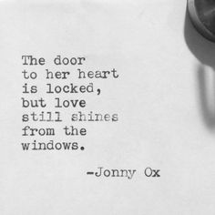 an old typewriter with the words'the door to her heart is locked, but love still shines from the windows '