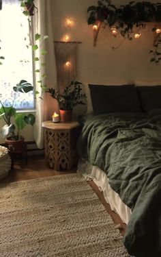 a bedroom with plants and lights on the wall