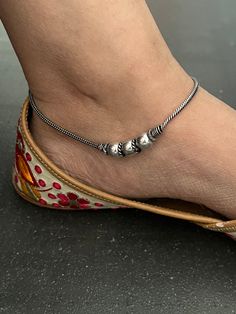 A beautiful pair of anklets handcrafted in brass and antique polish. Hook Closure  Weight: 30 grams per pair  Length of Anklets: 10 inches. Handmade Adjustable Anklets, Adjustable Metal Anklets For Festivals, Adjustable Metal Anklet For Festive Occasion, Metal Anklets For Festivals Gift, Handmade Adjustable Anklets For Festive Season, Adjustable Metal Traditional Anklets, Traditional Adjustable Metal Anklets, Festive Handmade Adjustable Anklets, Metal Anklets With Silver Beads For Festivals