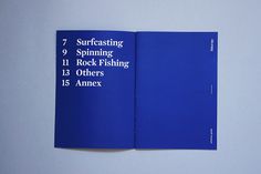 a blue book with white lettering on the front and back cover is open to show information about different types of fishing