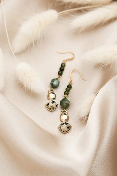 Our Logan earrings showcase the exquisite claudette design in a stunning drop style. Measuring approximately 2 inches in length, these beauties add a touch of sophistication and elevate any outfit to a new level of luxury. Materials & Details Available in 3 variations: moonstone and freshwater pearl; sodalite, labradorite and moonstone; or green serpentine, moss agate, and dalmatian jasper* approx 2 inch at longest measurement Gold plated brass ear wires | Free of nickel, lead, and cadmium *Stone colors and patterns will vary slightly, but will be just as beautiful and similar to the colors shown.