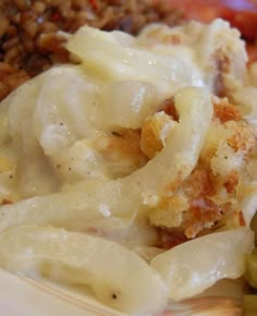 a white plate topped with pasta and vegetables