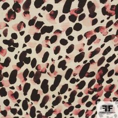 an animal print fabric with pink and black spots on it's surface, showing the pattern